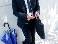 unrecognizable-businessman-with-briefcase-umbrella-standing-outdoors-using-smartphone(2)